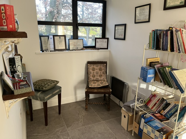 Reading nook and framed certifications at the clinic