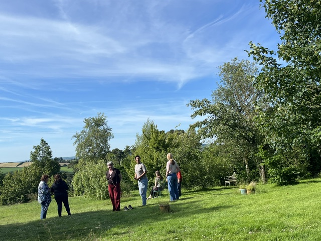 A shamanic circle gathered in the garden at Danu Lodge, looking out over the Wicklow / Wexford hills