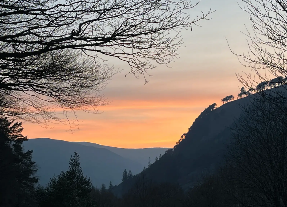 Last light burning along the valley ridge